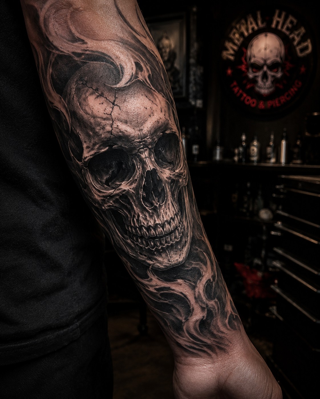 Black and gray skull forearm tattoo